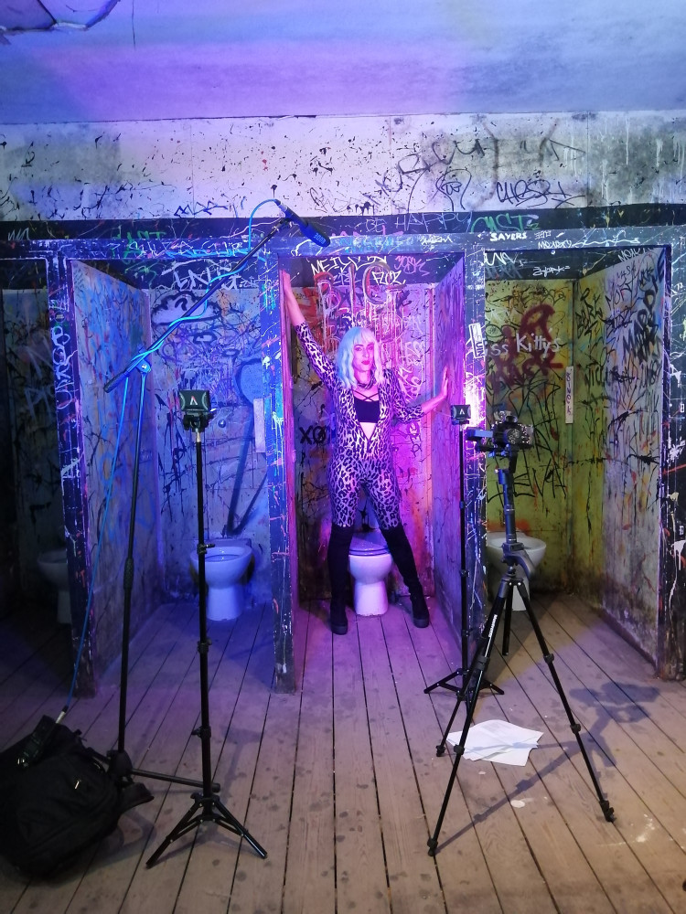 Jane Claire Bradley filming on the set of the video for Latrinalia
