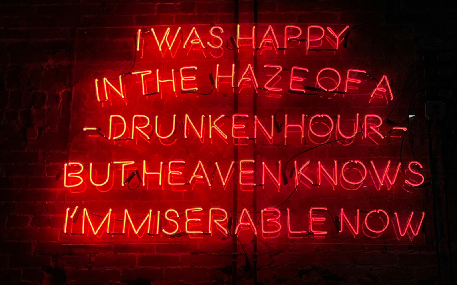 Neon Smiths lyrics by Ben Valenzuela via Unsplash