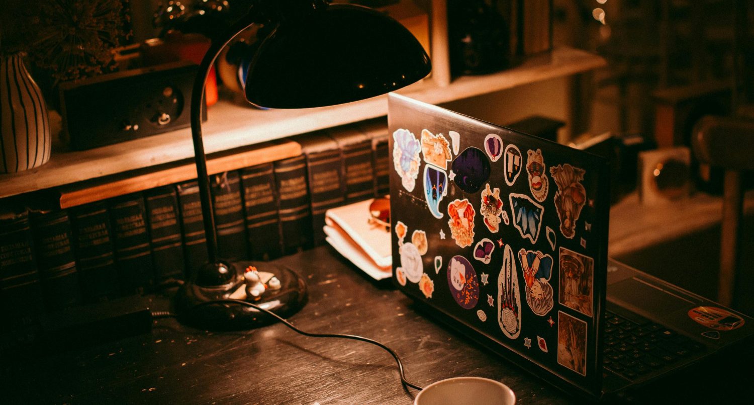 Image of laptop with stickers via Svetlana Romashenko on Pexels