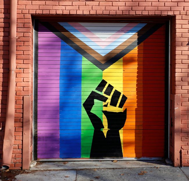 Garage with graffiti of Pride protest flag