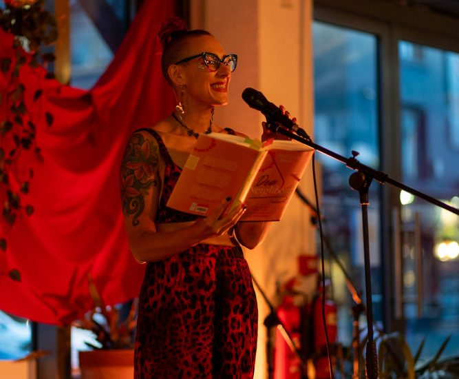 Jane reading the launch of Dear Neighbour in Manchester in June 2023 - photo by Laura Kidd
