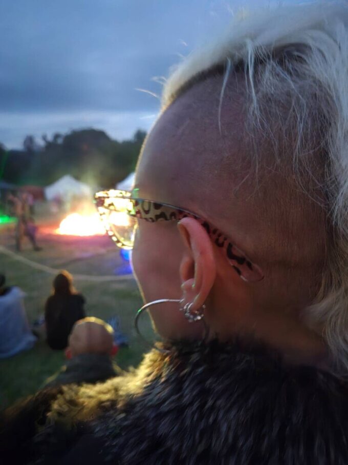 Jae watching the wolf burn at Solskin Festival